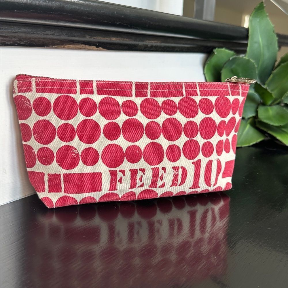 FEED red canvas zip-top pouch clutch, like new, limited edition charity bag